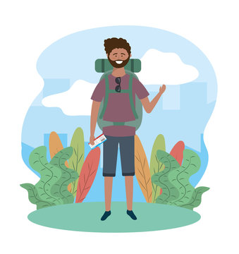 travel man in the plants with sunglasses and backpack