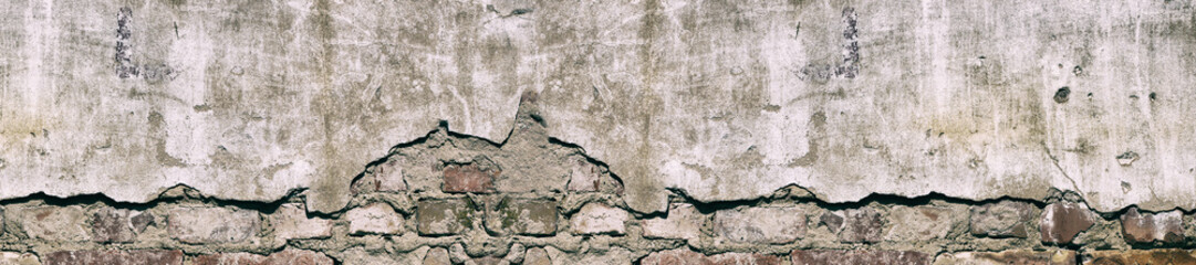 Obraz premium Panorama old damaged brick wall with shabby plaster.