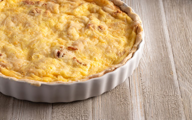 A Whole Quiche Lorraine on a Wooden Table