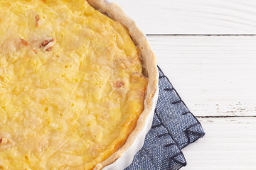 A Whole Quiche Lorraine on a Wooden Table
