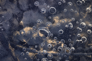 Texture abstract closeup background ice with grooves, furrows, and bubbles of air cought by frost...