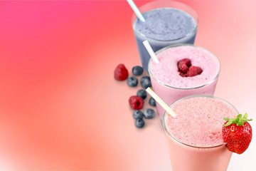 Three Fruit Smoothies with Straws  Isolated on a White Background