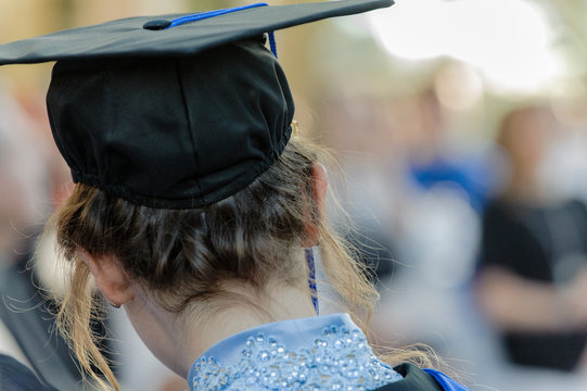 Young female student attends graduation ceremony