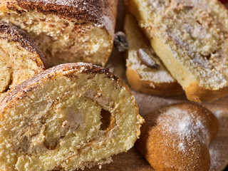 Slice rolled biscuit cake with cream for breakfast dessert close up. Limitations for diabetics. Supplement for breakfast.