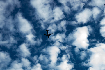 Plane flying in the cloudy sky