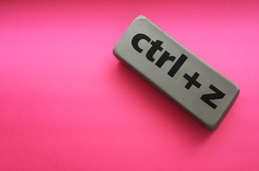 eraser with the inscription "ctrl + z" on a pink background