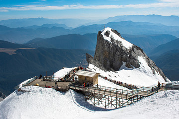 On the top of Dragon snow mountain in Lijiang Kunming China which covered by snow and crowed of...