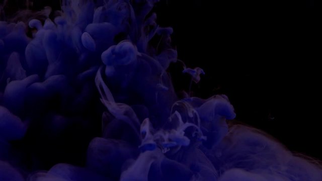 Purple cloud smoke - ink on the water on black background. Camera fixed, angle neutral, close up shoot, slow motion. (TOKYO, JAPAN - 10th May 2019).
