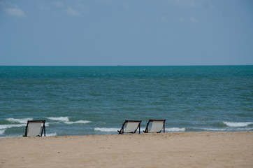 two travel chair in the beach with sea and blue sky background
