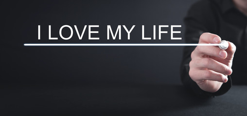 Man writes I Love My Life text in screen.