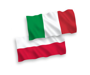 National vector fabric wave flags of Italy and Poland isolated on white background. 1 to 2 proportion.