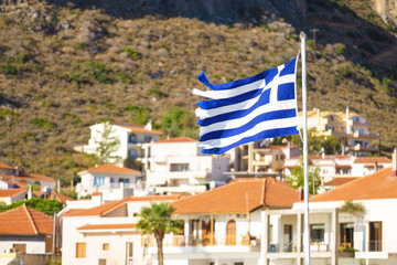 Fototapeta premium Greek flag against town