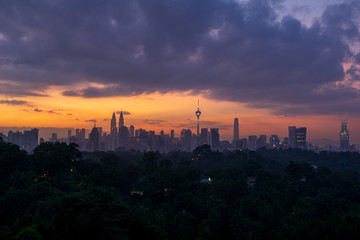 Cloudy sunrise over downtown Kuala Lumpur (KL). KL is the capital of Malaysia. 