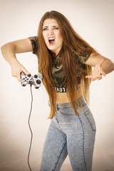 Angry woman holding gaming pad
