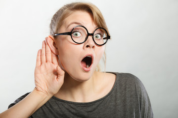 Shocked girl eavesdropping.