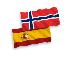 National vector fabric wave flags of Norway and Spain isolated on white background. 1 to 2 proportion.