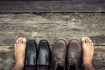 The decision between boots or leather shoes.