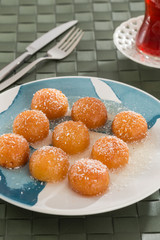 Turkish and Arabic Traditional Ramadan Dessert Kemalpasa with Turkish Tea