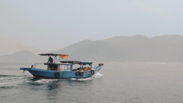 Slow Motion Vietnamese Fishing Boat Sailing Across The Bay