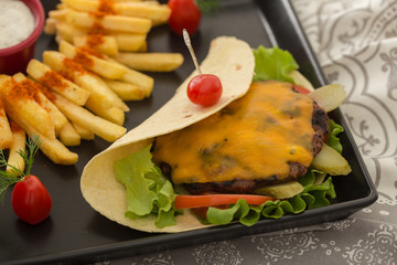 meatball with cheese served on tortilla