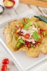 Taco Salad in a Tortilla Bowl with chicken and peppers 