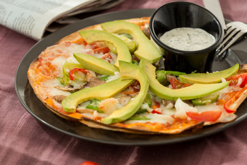 flat thin gourmet home made pizza, sliced top view and olive oil