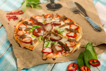 flat tortilla gourmet pizza chilli and on paper