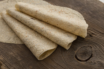 Lavash, tortilla, lavaş, flat and thin bread on table 