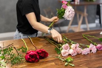 The job of a florist. Master class on making bouquets. Summer bouquet. Learning flower arranging, making beautiful bouquets with your own hands. Flowers delivery