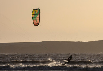 Kitesurfers at sunset in Essaouira, Morocco