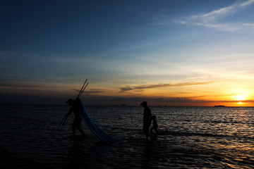 Fototapeta na wymiar silhouette of fisherman family.
