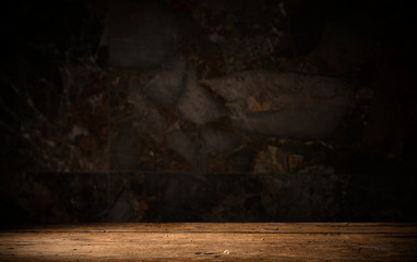 Old wooden table with brick background dark