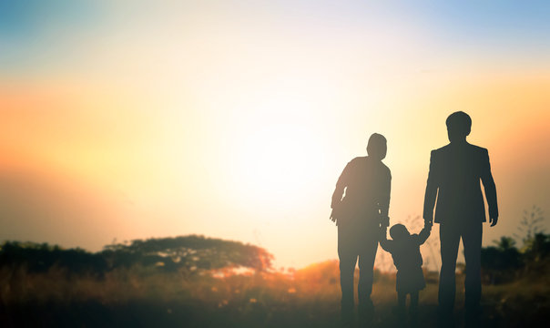 Global Day of Parents concept:   Family at sunrise background