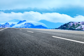 Empty asphalt road and beautiful huangshan mountains with clouds sea nature landscape