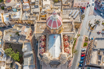 Zabbar Parish Church on the island of Malta, aerial view above, around typical houses buildings.