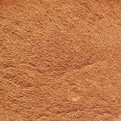 Background of poured ground cinnamon         