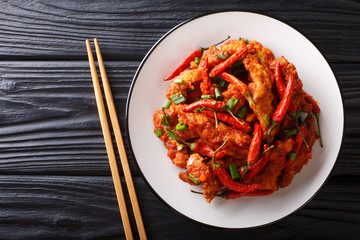 Schezwan chicken or szechuan chicken is a popular appetizer from the Chinese cuisine close-up on...