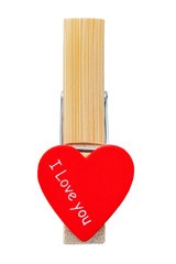 Clothespin with red heart and with text love you on an white isolated background.