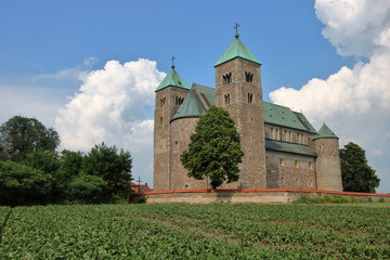 Collegiate Church of St. Mary and St. Alexius in Tume, Poland, view from field © Wioletta