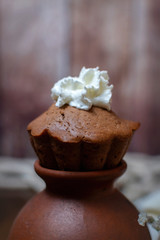 chocolate cake drop of whipped cream in warm colors, close-up