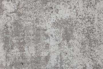 The texture of the old grey concrete wall with scratches, cracks, dust, crevices, roughness, stucco. Can be used as a poster or background for design