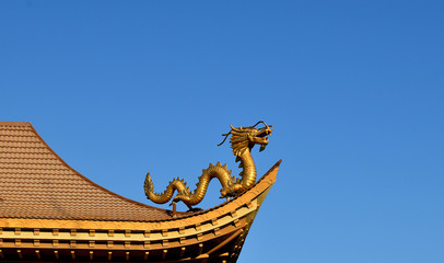 Fototapeta na wymiar Golden dragon, sky background, architecture, Chinese.