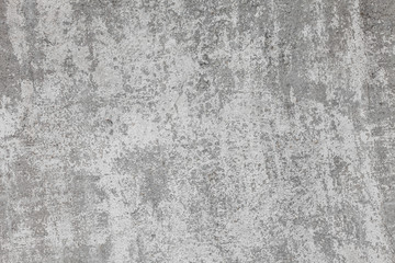 The texture of old concrete wall for background with a concrete splash on the wall 