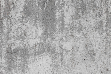 The texture of old concrete wall for background with a concrete splash on the wall 
