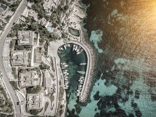 Beautiful birdeye view on the sea coastline with pier and yakhts