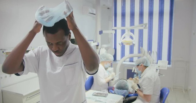 black intern want to take part in dental treatment.