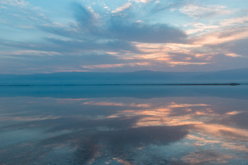 Fototapeta premium Sunrise above the Dead sea, beautiful reflections on the water