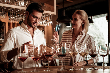 Pleased female person looking at her boyfriend
