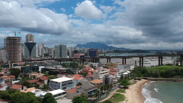 Aerial footage on drone of traffic arriving at Third Bridge toll in Vit&oacute;ria, Esp&iacute;rito Santo, Brazil. Beautiful day on a tropical city.