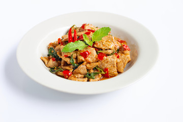 Stir-fried hot and spicy pork with holy basil on white